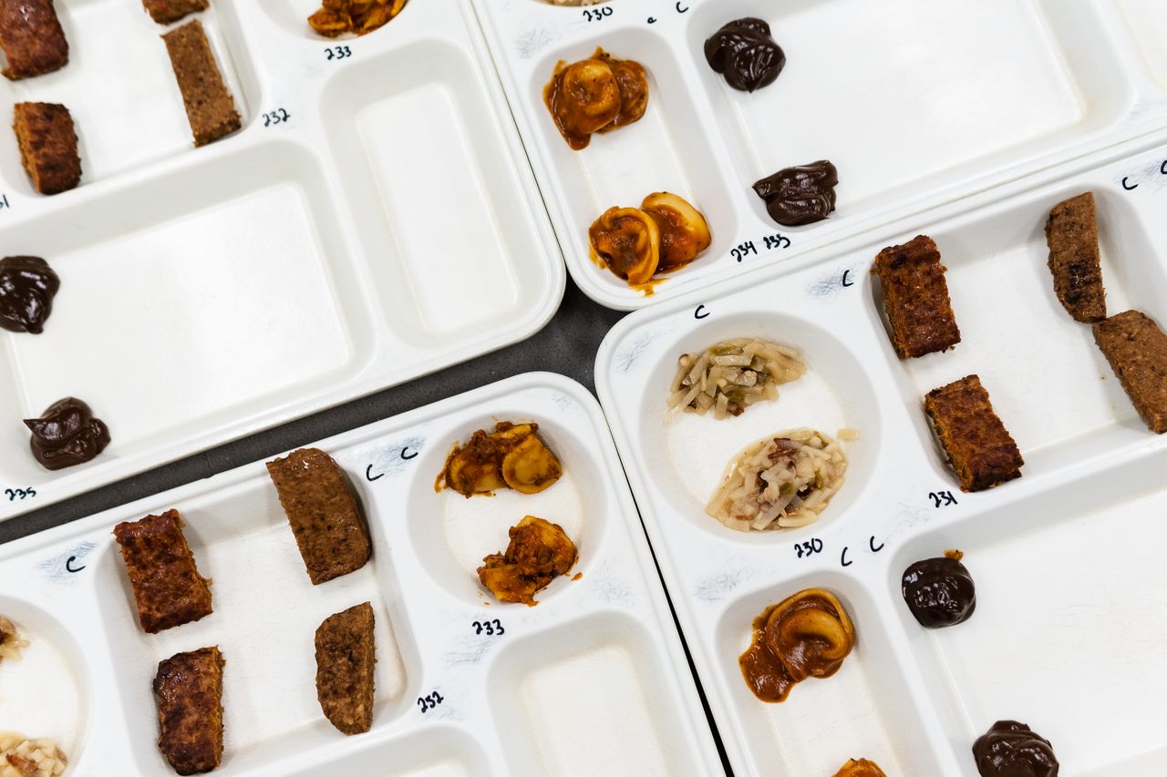 Trays at the US Army Research Institute of Environmental Medicine’s Metabolic Kitchen are prepared for an employee taste-testing panel. 